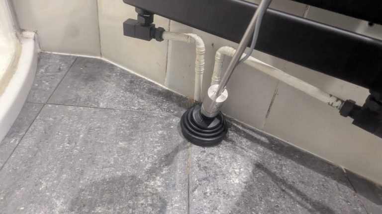 leak detected to central heating pipe beneath the tiled floor.